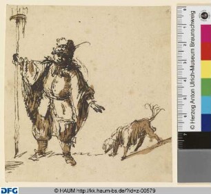 Mann mit Pelzmütze und Hund