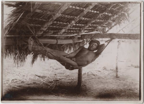 Kayapó Indians in an improvised hammock