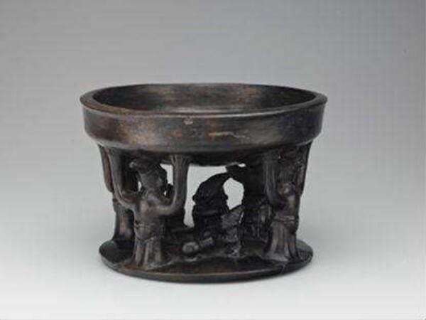 Offering bowl, carried by 4 figures over a figurative representation