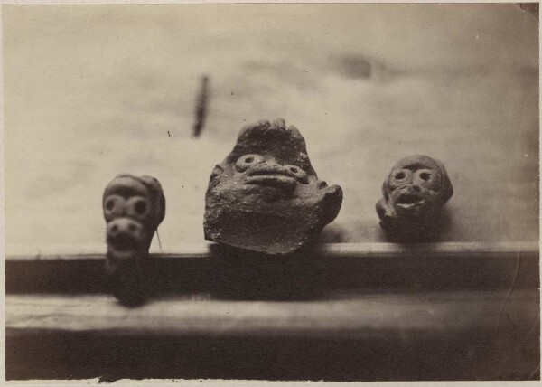 Three stone heads