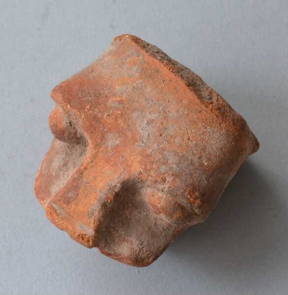 Clay head (vessel fragment)