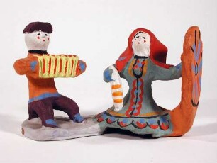 Figurengruppe, Harmonikaspieler und spinnende Frau