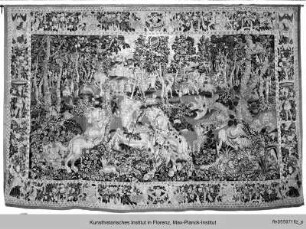 Wandteppich mit Jagdszene und Einhorn eingefasst in einer Rahmenbordüre - Arazzo con scene della caccia ad un unicorne