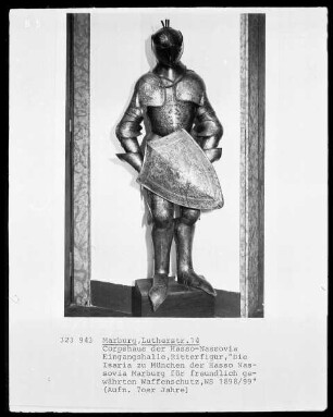 Ritterfigur, betitelt: "Die Isaria zu München der Hasso Nassovia Marburg für freundlich gewährten Waffenschutz, WS 1898/99"
