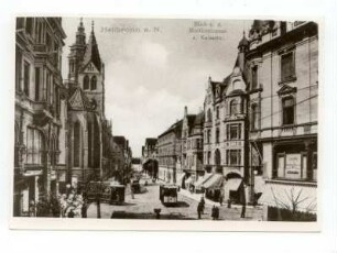 "Blick von der Moltkestraße auf Kaiserstraße" - Kaiserstraße, oberer Teil, ab Kreuzung Sülmerstraße / Kiliansplatz, Blick Richtung Käthchenhaus. Im Vordergrund Kaiserstraße 25 mit Firmenschild M. Schneider; Straßenbahnen