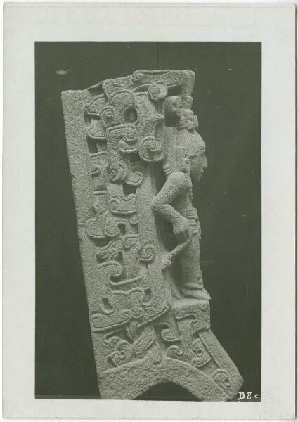 Side view of a stone figure, upper part broken off, side parts with rich stylised ornamentation. Guillermo de Heredia Collection.