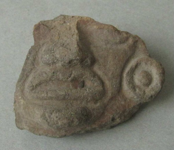 Clay head (fragment)