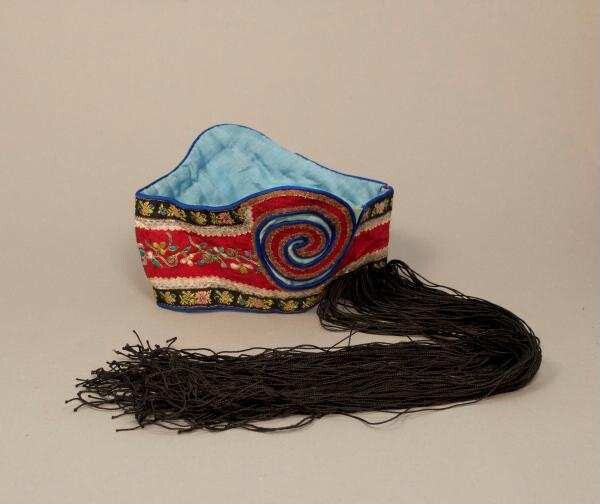 Decorated headband with attached long fringes