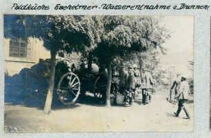 Foto der Wasserentnahme am Brunnen bei der Feldküche in Eschelmer (Hachimette)