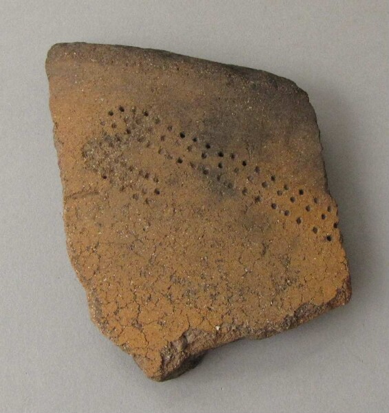 Rim sherd of a clay vessel