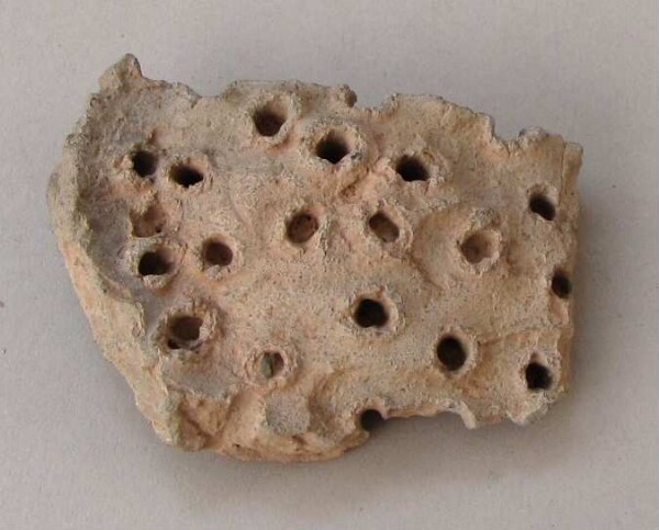 Fragment of a clay vessel