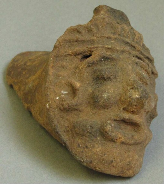 Human head from the lower end of a smoking spoon handle