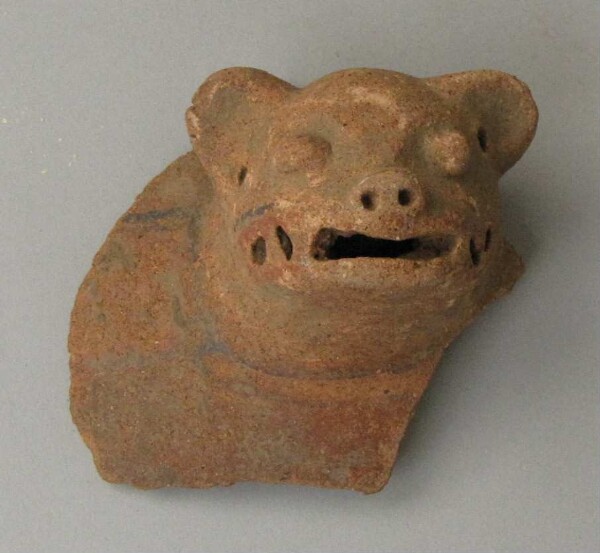 Clay head of an animal figure