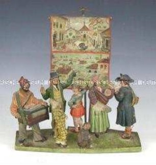 Eine Bänkelsänger mit den Ansichten eines Erdbebens und einer Überschwemmung - Figurengruppe mit Schautafel