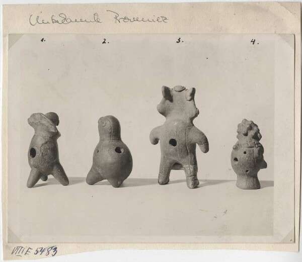 Four figurative depictions in clay. (Hollow figures with holes, possibly flutes.) Reverse sides.