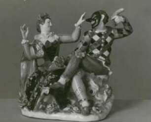 Harlekin mit Wurst und Colombine