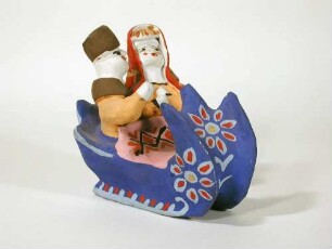 Figurengruppe, Frau und Mann im Schlitten