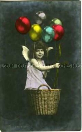 Mädchen im Korb mit Luftballons