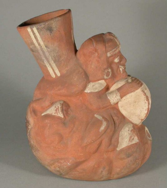 Relief: anthropomorphic and zoomorphic figures with drum