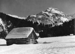 Winterbilder. Hütte im Hochgebirge (wahrscheinlich in den Alpen)