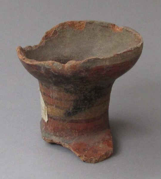 Fragments of a clay bowl with stand