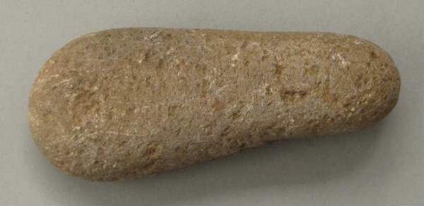 Stone axe blade (?)