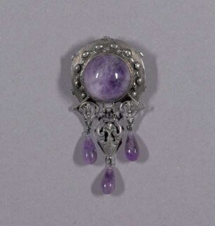 Runde silberne Brosche mit Amethysten