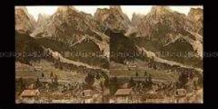 Hütten am Gosausee mit Gebirgshintergrund
