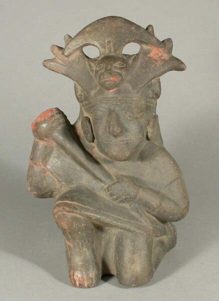 Kneeling anthropomorphic figure