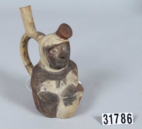 Fork-necked vessel in the shape of a seated person