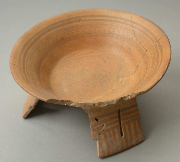 Three-footed clay bowl