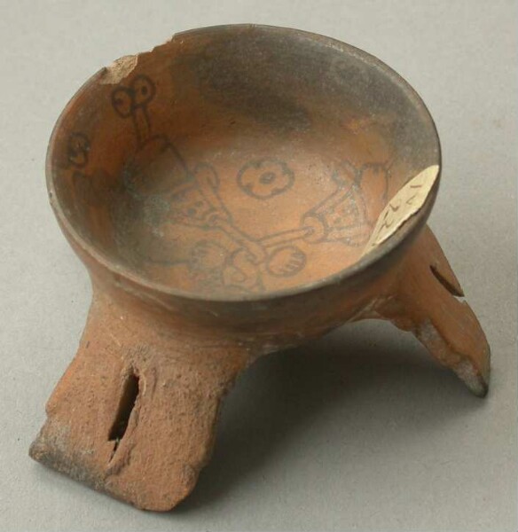 Three-footed clay bowl