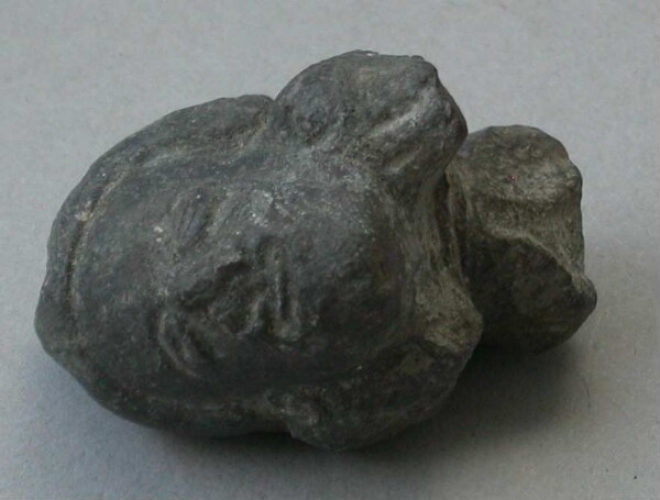 Fragment of a clay rattle (clay head)