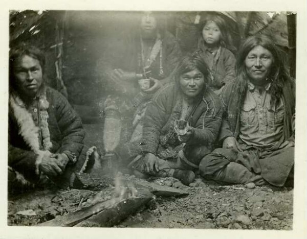 Men in a tent by a fire