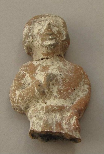 Upper body with head of a clay figure