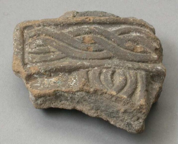 Fragment of a clay vessel