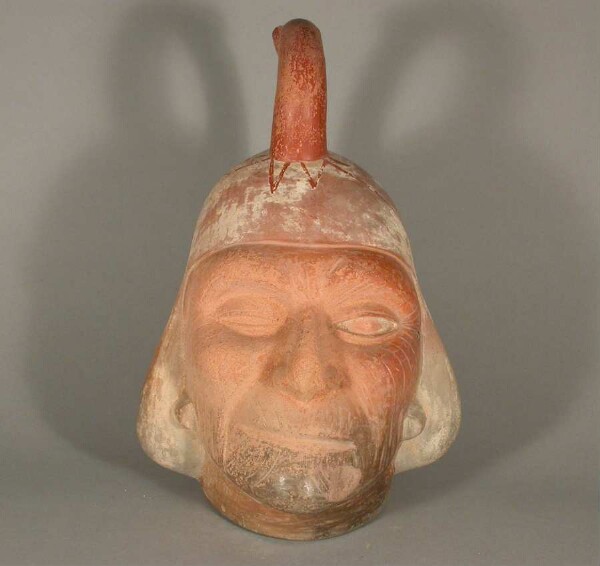 Figure vessel with stirrup spout