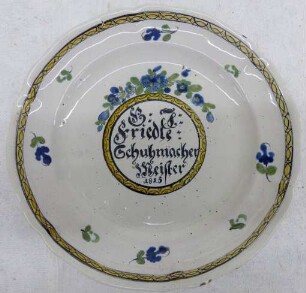 Platte mit Namenszug