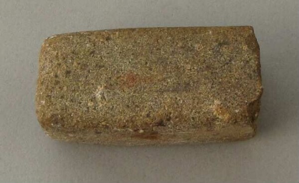 Stone axe blade (?)