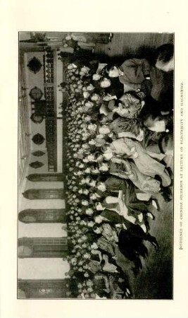 Audience of chinese students at lecture on electricity and magnetism