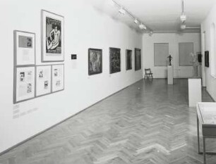 Plakat zur Ausstellung KG Brücke in der Galerie Arnold : Raumaufnahme im Kleinen Saal mit dem Plakat von E. L. Kirchner zur Ausstellung "KG Brücke, 1910"