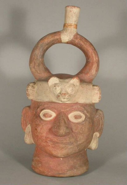 Figure vessel with stirrup spout