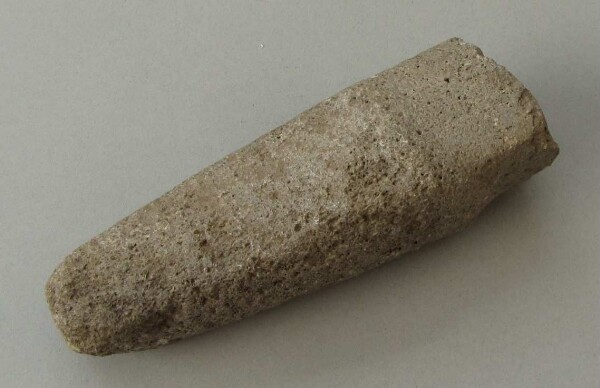 Stone axe blade (?)