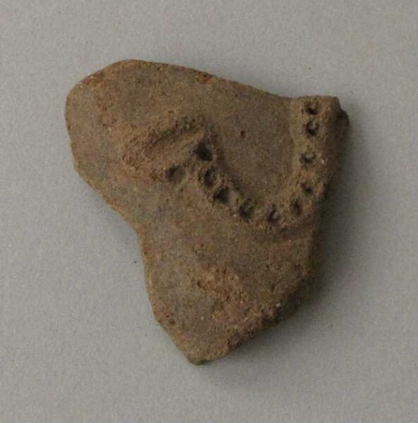 Clay shard of a vessel