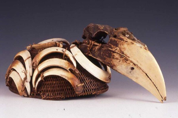 Reed hat with hornbill beak and boar's teeth