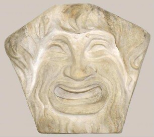 Relief einer lachenden Maske