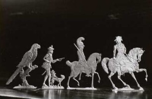 Gruppe von Zinnfiguren (Napoleon, Reiter, Jäger, Papagei)