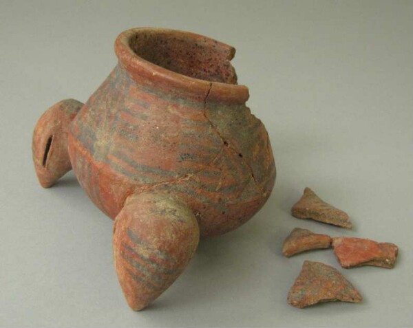 Fragments of a tripod pottery vessel