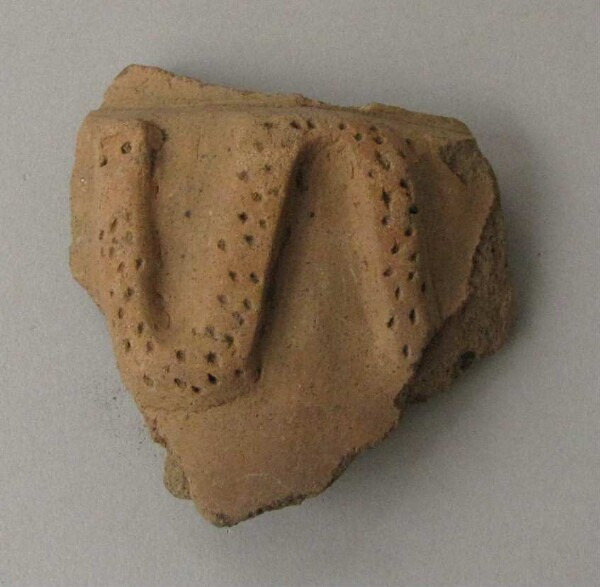 Clay shard of a vessel