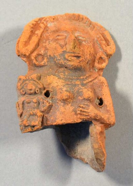 Upper body with head of a clay figure